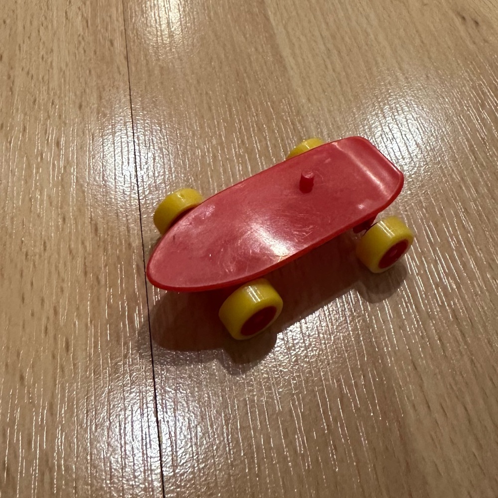 Red and Yellow Kids Toy Skateboard